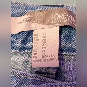 US size 28 blue ripped jeans